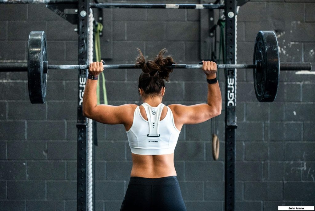 image of woman lifting weights