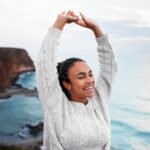A lady reaching above her head