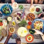 people around a table for a holiday meal