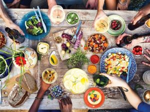 people around a table for a holiday meal