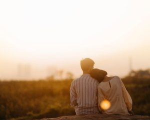 A man and a woman standing and hugging