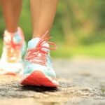 The feet of a person walking.