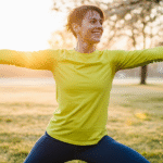 A woman exercising in a park.