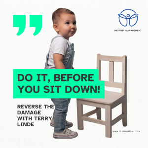 A toddler standing in front of a chair.
