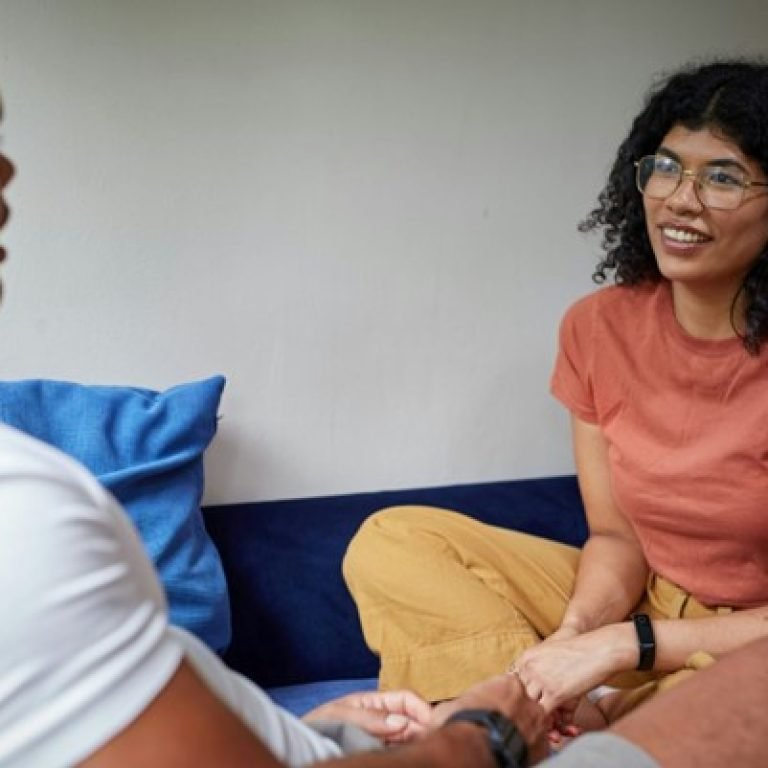 a man and a woman sitting and talking