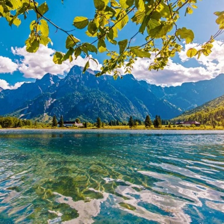 An image of a lake with a mountain in the background.