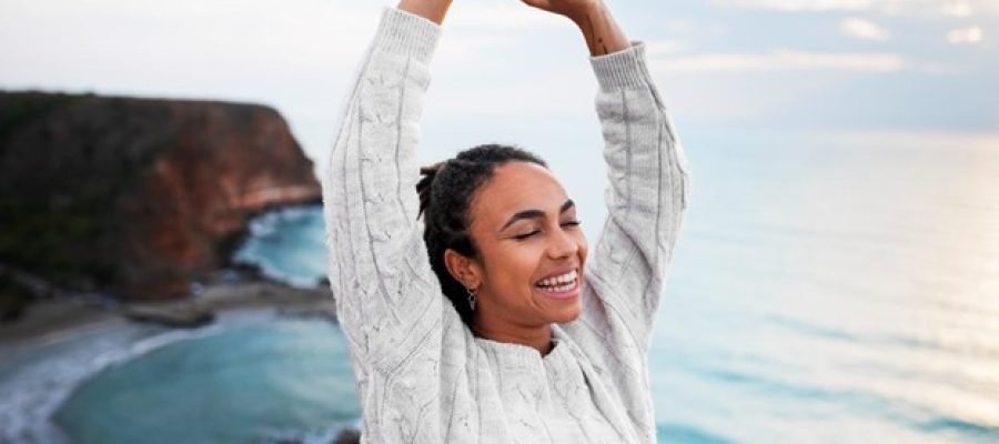 A lady reaching above her head