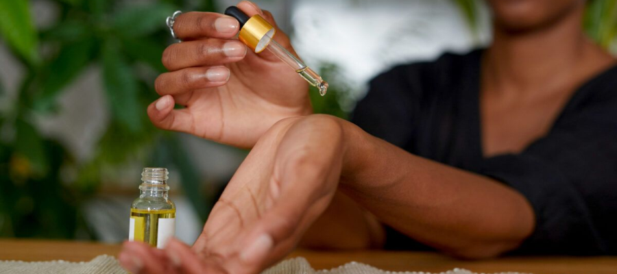 A woman put drops on her wrist