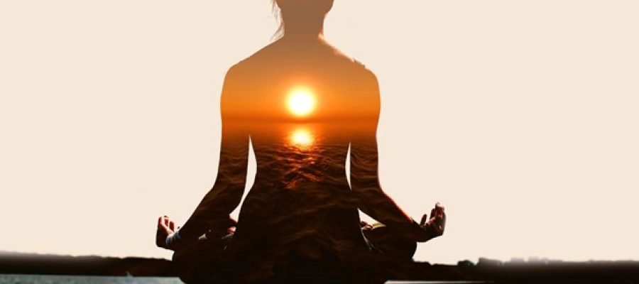 a woman practicing mediation with yoga